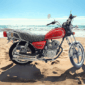 Moto TMAS 150cc color rojo con motor GY6 y luces delanteras